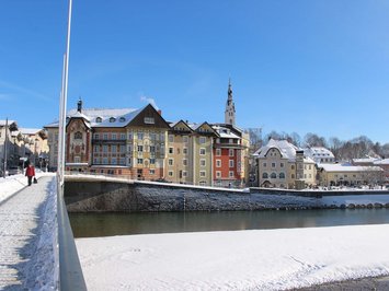Winter bliss in Bad Tölz Winter view of colorful houses and river in a small town